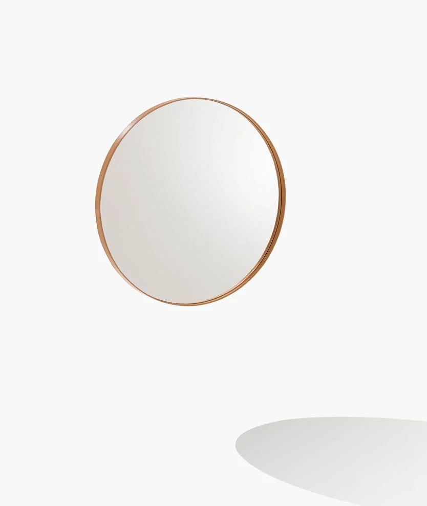 Round mirror with a wooden frame